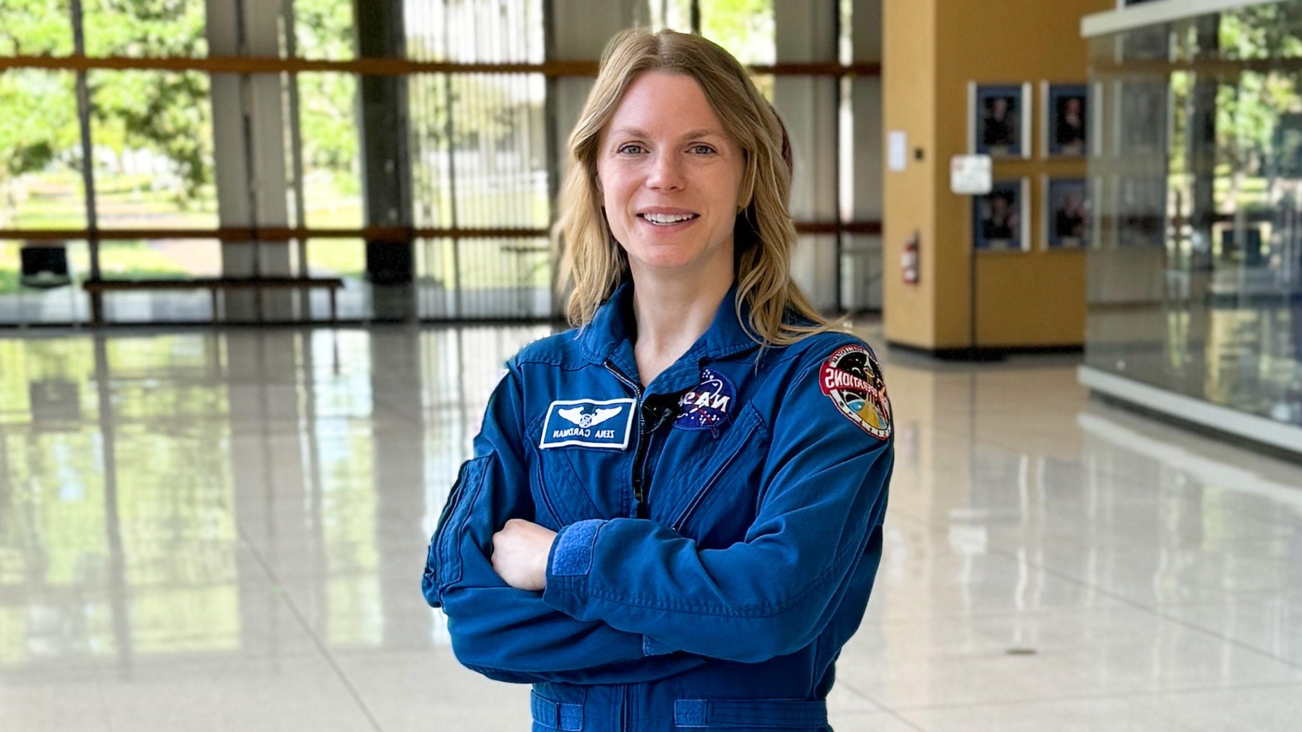 Zena Cardman in blue flight suit.